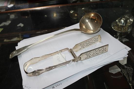 An early Victorian silver fiddle, thread and shell pattern soup ladle, William Eaton, London, 1839 & asparagus servers.